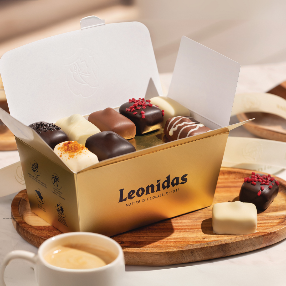 Open Leonidas chocolate box with an assortment of manon collection