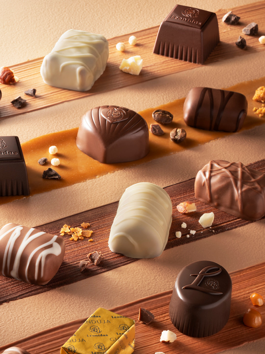 Assorted pralines on a wooden surface with a soft focus background